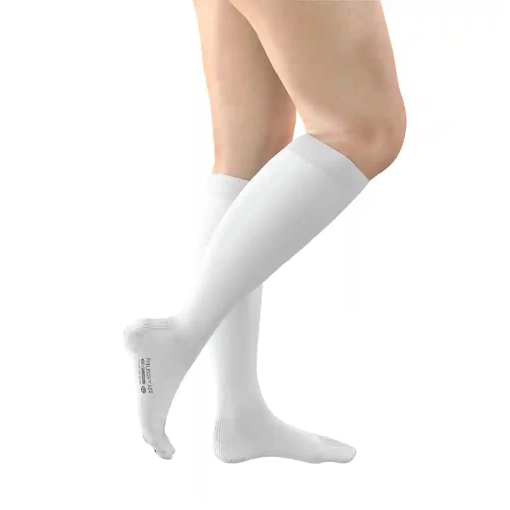 Model wearing white knee-high socks on bare legs, shown from knee to foot against a white background.