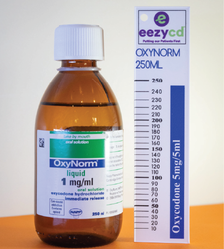 Brown bottle of OxyNorm liquid with white cap beside its tall 250 mL box labeled oxycodone 5 mg/5 mL.