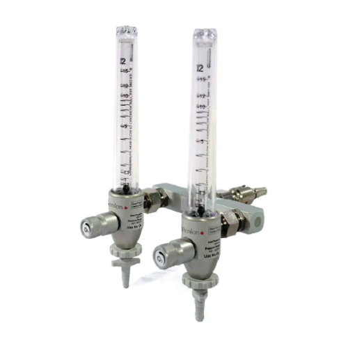 Dual gas regulators with vertical glass flowmeters attached to a metal manifold and control knobs for adjusting gas flow (lab/industrial equipment).