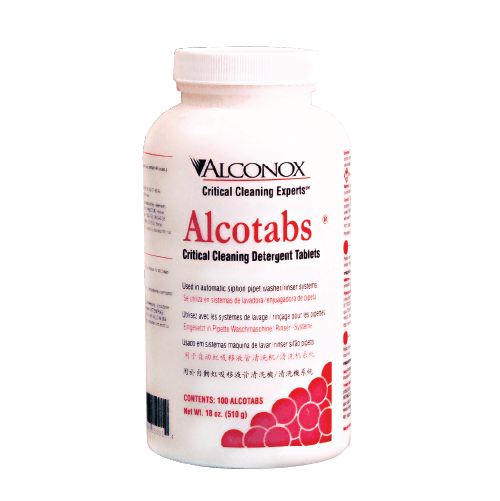 White plastic bottle labeled 'Alconox Alcotabs'—critical cleaning detergent tablets, for industrial cleaning.